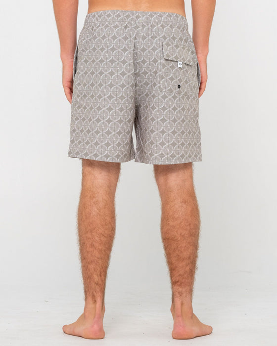 man-wearing-all-over-elastic-waist-boardshort-in-abbey-stone