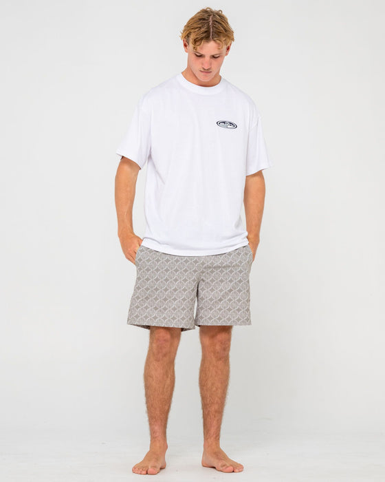 man-wearing-all-over-elastic-waist-boardshort-in-abbey-stone
