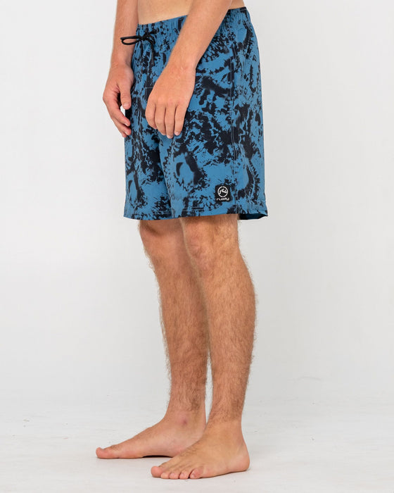 man-wearing-all-over-elastic-waist-boardshort-in-atlantic-blue