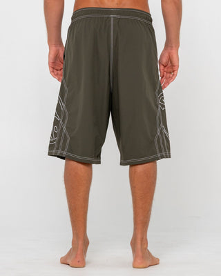 Man wearing Tombstones Hybrid Waist Boardshort in Army Green