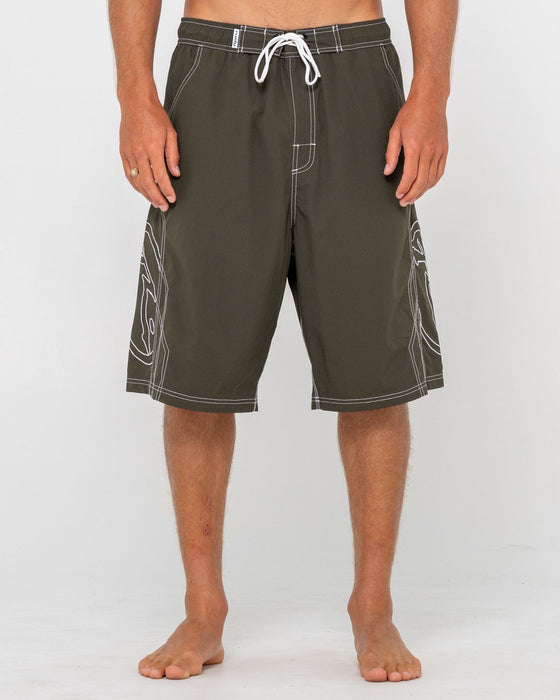 man-wearing-tombstones-hybrid-waist-boardshort-in-army-green