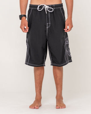 Man wearing Tombstones Hybrid Waist Boardshort in Black