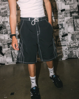 Man wearing Tombstones Hybrid Waist Boardshort in Black