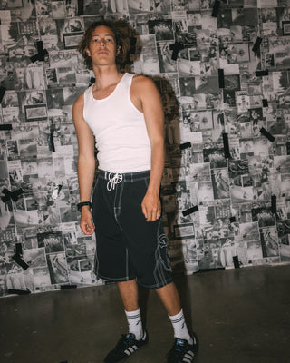 Man wearing Tombstones Hybrid Waist Boardshort in Black