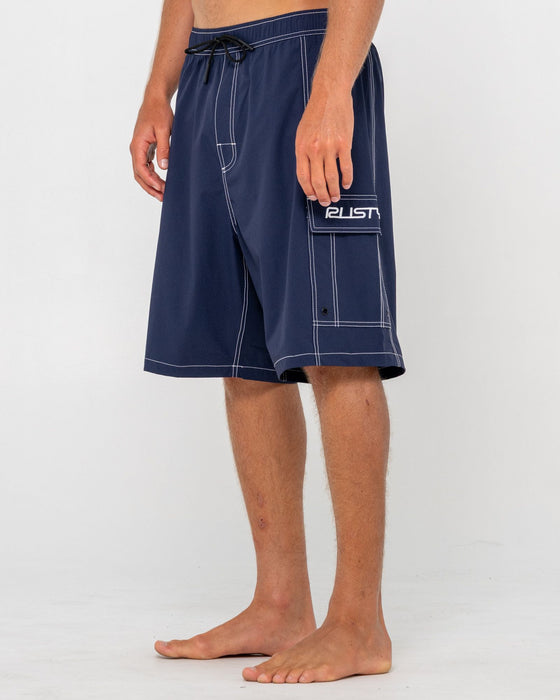 man-wearing-pick-pocket-elastic-waist-boardshort-in-navy-blue