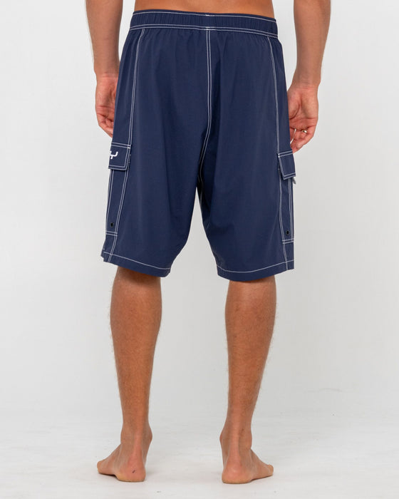 man-wearing-pick-pocket-elastic-waist-boardshort-in-navy-blue