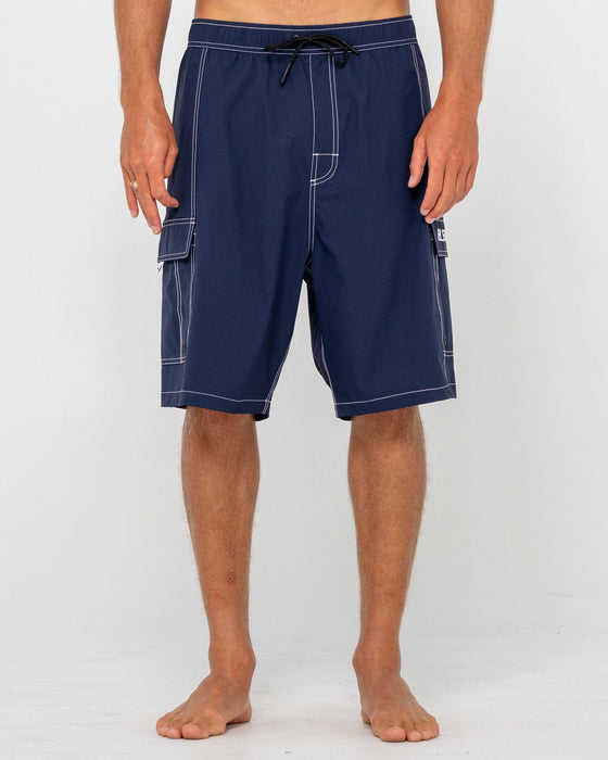 man-wearing-pick-pocket-elastic-waist-boardshort-in-navy-blue