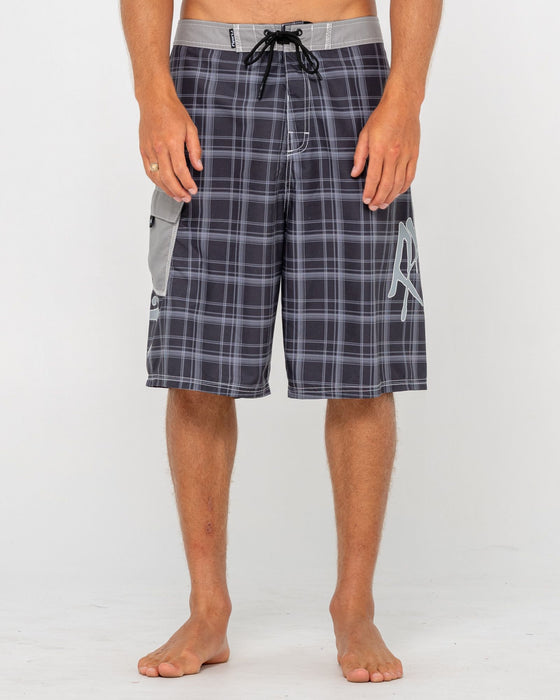 man-wearing-hoodus-fixed-waist-boardshort-in-black