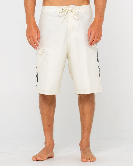 man-wearing-hoodus-fixed-waist-boardshort-in-cream