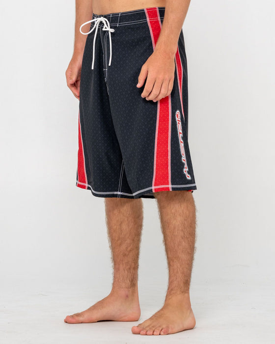 man-wearing-cybernate-fixed-waist-boardshort-in-black