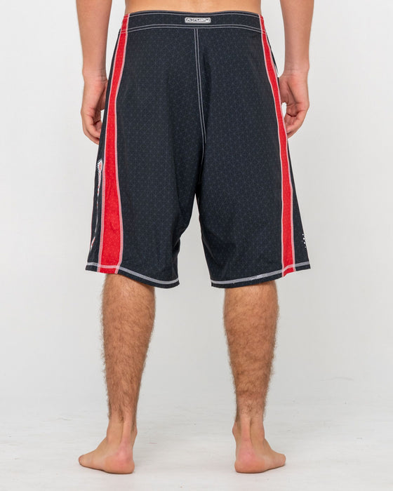man-wearing-cybernate-fixed-waist-boardshort-in-black