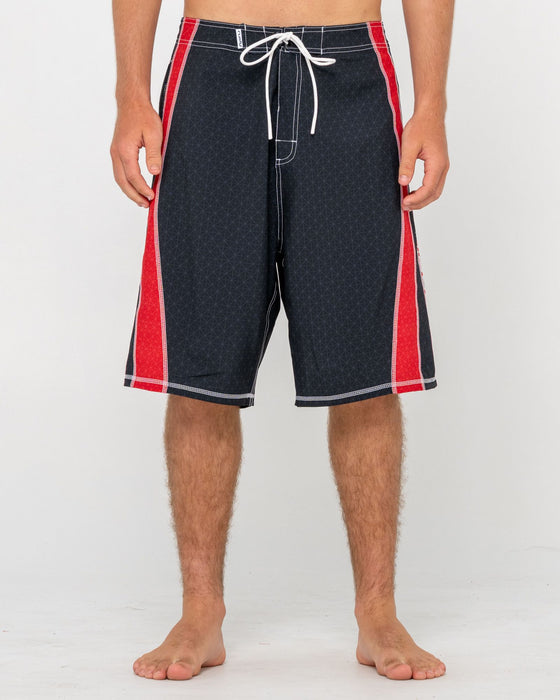 man-wearing-cybernate-fixed-waist-boardshort-in-black