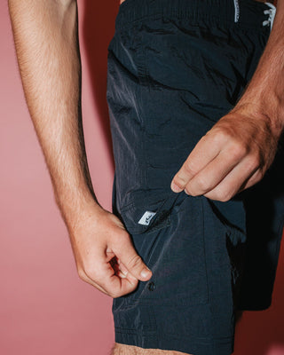 Man wearing Peek Show Hybrid Waist Boardshort in Black