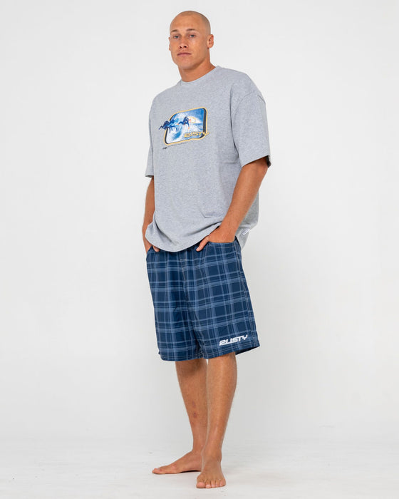 man-wearing-plaid-daddy-elastic-waist-boardshort-in-navy-blue