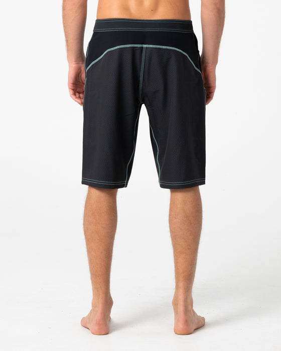 man-wearing-hydro-surge-fixed-waist-boardshort-in-black