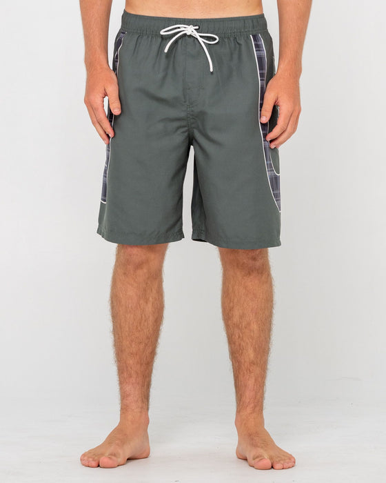 man-wearing-charger-elastic-waist-boardshort-in-army-green