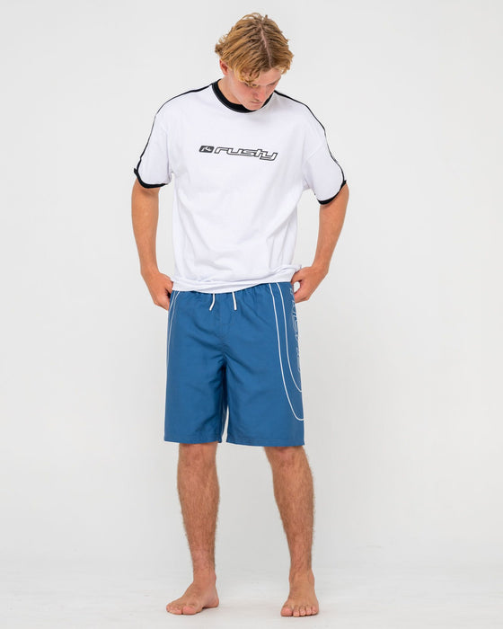 man-wearing-charger-elastic-waist-boardshort-in-atlantic-blue