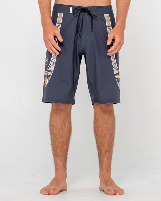 man-wearing-charger-fixed-waist-boardshort-in-coal
