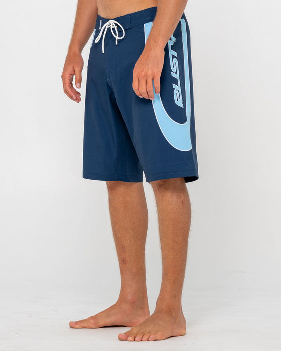 man-wearing-charger-fixed-waist-boardshort-in-navy-blue