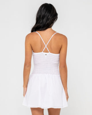 Woman wearing Mimi Smocked Mini Dress in White