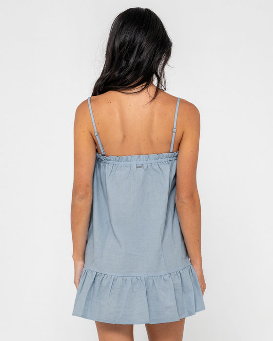 woman-wearing-mary-weather-slip-dress-in-retro-blue