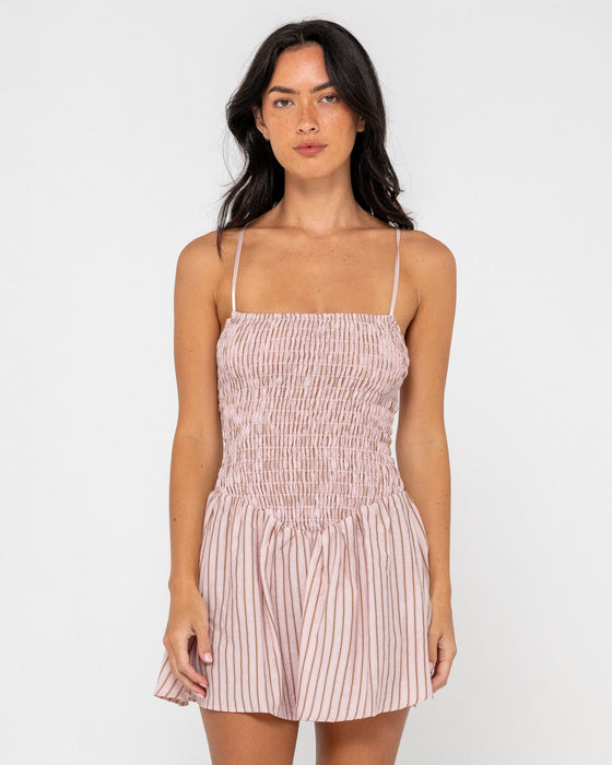 woman-wearing-mimi-smocked-stripe-mini-dress-in-pink-stripe
