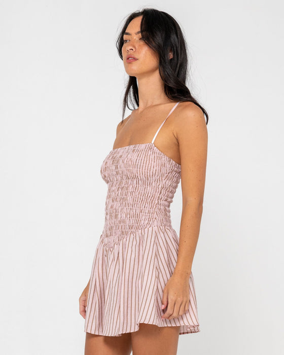 woman-wearing-mimi-smocked-stripe-mini-dress-in-pink-stripe