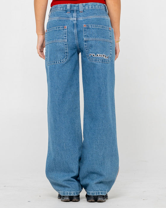 woman-wearing-flip-mommy-low-rise-wide-leg-denim-jean-in-middy-blue-orange