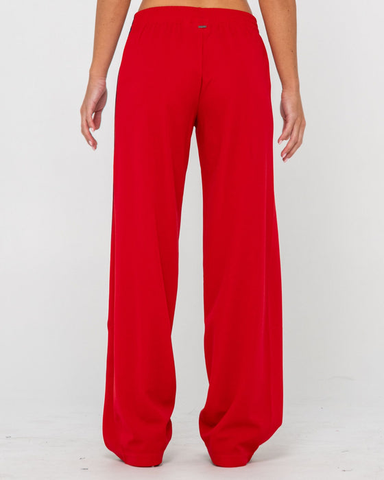 woman-wearing-bronson-low-rise-trackpant-in-red
