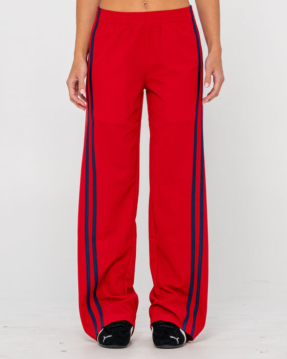 woman-wearing-bronson-low-rise-trackpant-in-red