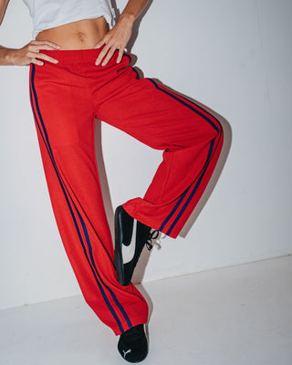 Woman wearing Bronson Low Rise Trackpant in Red