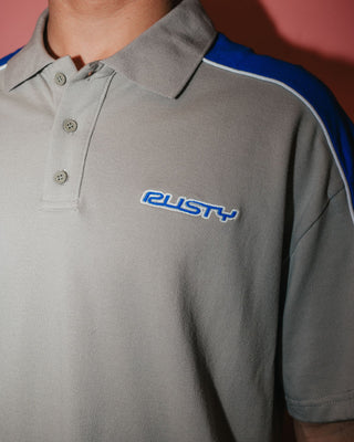 Man wearing Straight Shooter Short Sleeve Polo in Ultimate Grey