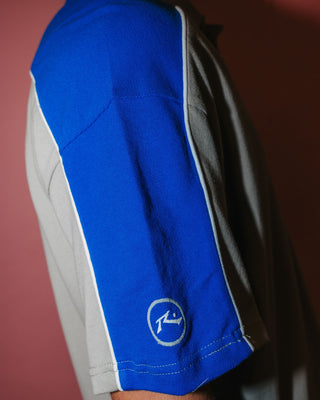 Man wearing Straight Shooter Short Sleeve Polo in Ultimate Grey