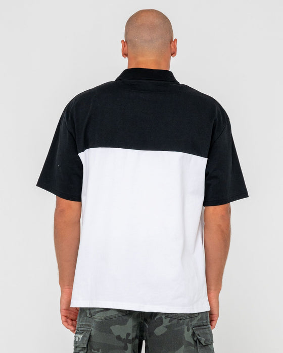 man-wearing-locked-and-loaded-short-sleeve-polo-in-black