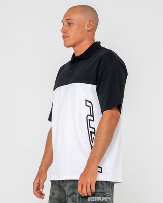 Man wearing Locked And Loaded Short Sleeve Polo in Black