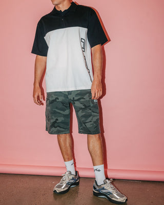 Man wearing Locked And Loaded Short Sleeve Polo in Black