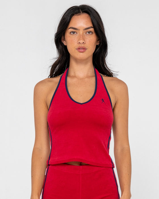 woman-wearing-bodhi-towelling-halter-neck-top-in-red