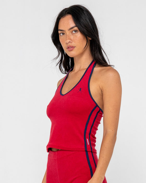 woman-wearing-bodhi-towelling-halter-neck-top-in-red