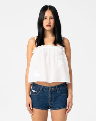 Woman wearing Feyre Cami Top in White