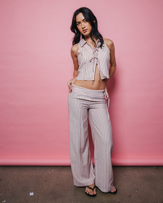 Woman wearing Rhysand Stripe Tie Top in Pink Stripe