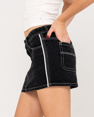 Woman wearing Flip Mommy Low Rise Mini Denim Skirt in Black Out