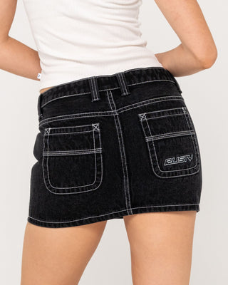 Woman wearing Flip Mommy Low Rise Mini Denim Skirt in Black Out