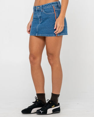 Woman wearing Flip Mommy Low Rise Mini Denim Skirt in Middy Blue / Orange