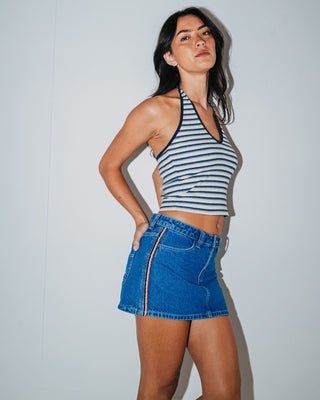 Woman wearing Flip Mommy Low Rise Mini Denim Skirt in Middy Blue / Orange