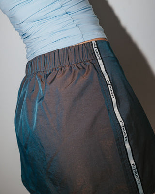 Woman wearing Lombardi Nylon Mini Skirt in Olive