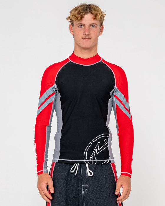 man-wearing-spitfire-long-sleeve-surf-top-in-black-1