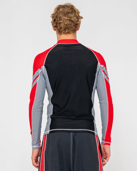 man-wearing-spitfire-long-sleeve-surf-top-in-black-1