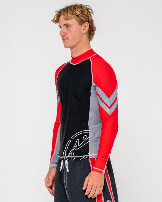 man-wearing-spitfire-long-sleeve-surf-top-in-black-1