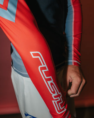 Man wearing Spitfire Long Sleeve Surf Top in Black 1