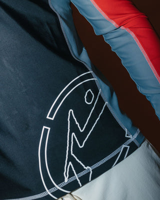 Man wearing Spitfire Long Sleeve Surf Top in Black 1